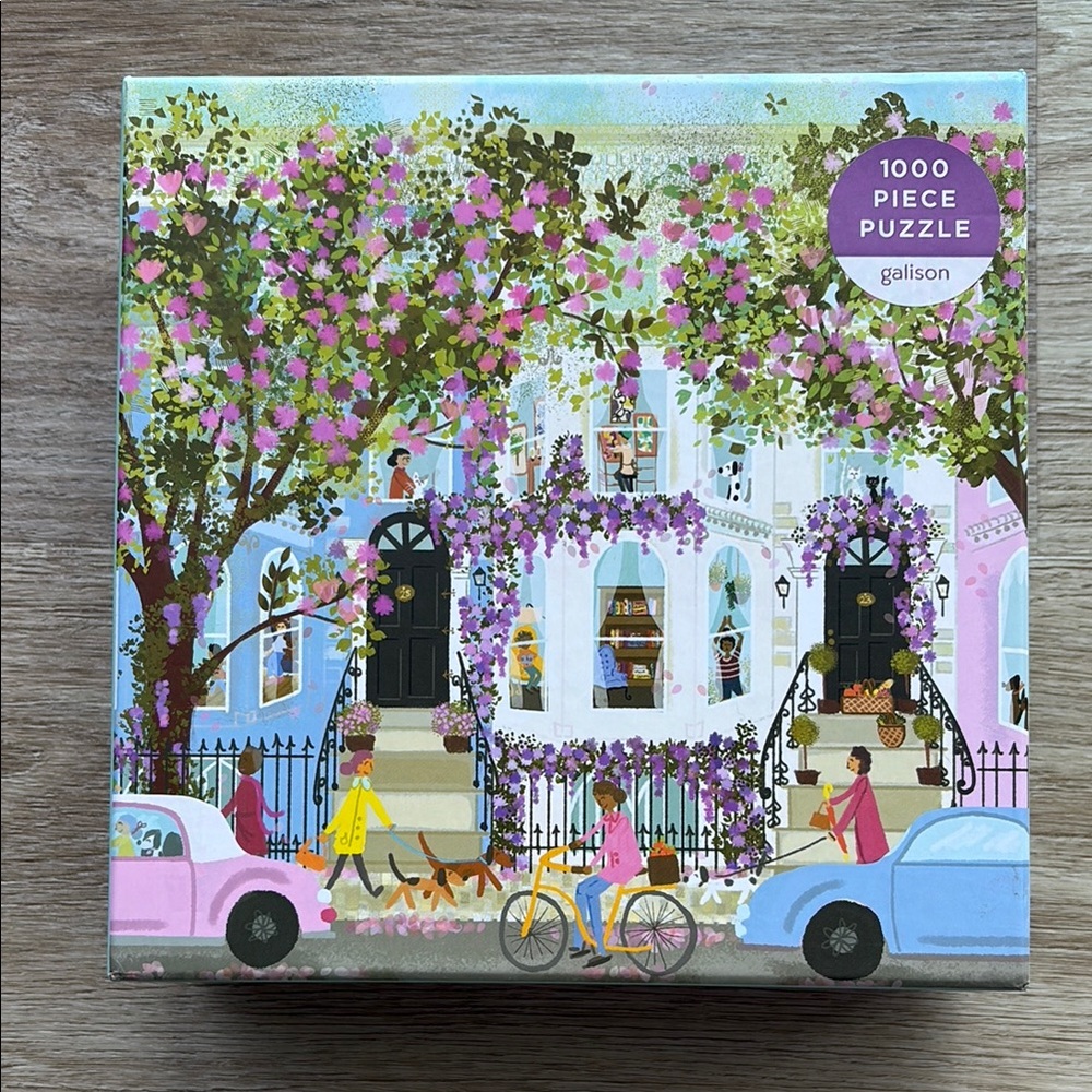 Galison Spring Terrace 1000 Piece Puzzle with Floral Street Scene. 27x20”.